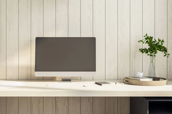 Modern desktop with empty black computer screen and blank wooden wall. Workplace and lifestyle concept. Mock up, 3D Rendering