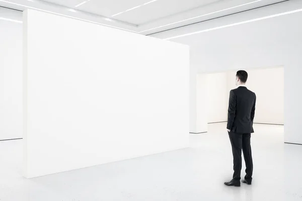 Businessman Minimalistic Gallery Interior Looking Blank Presentation Wall Art Design — Stock Photo, Image
