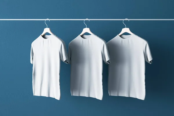 Put Your Sign Concept Three Blank White Shirts Hanging Blue — Stock Photo, Image