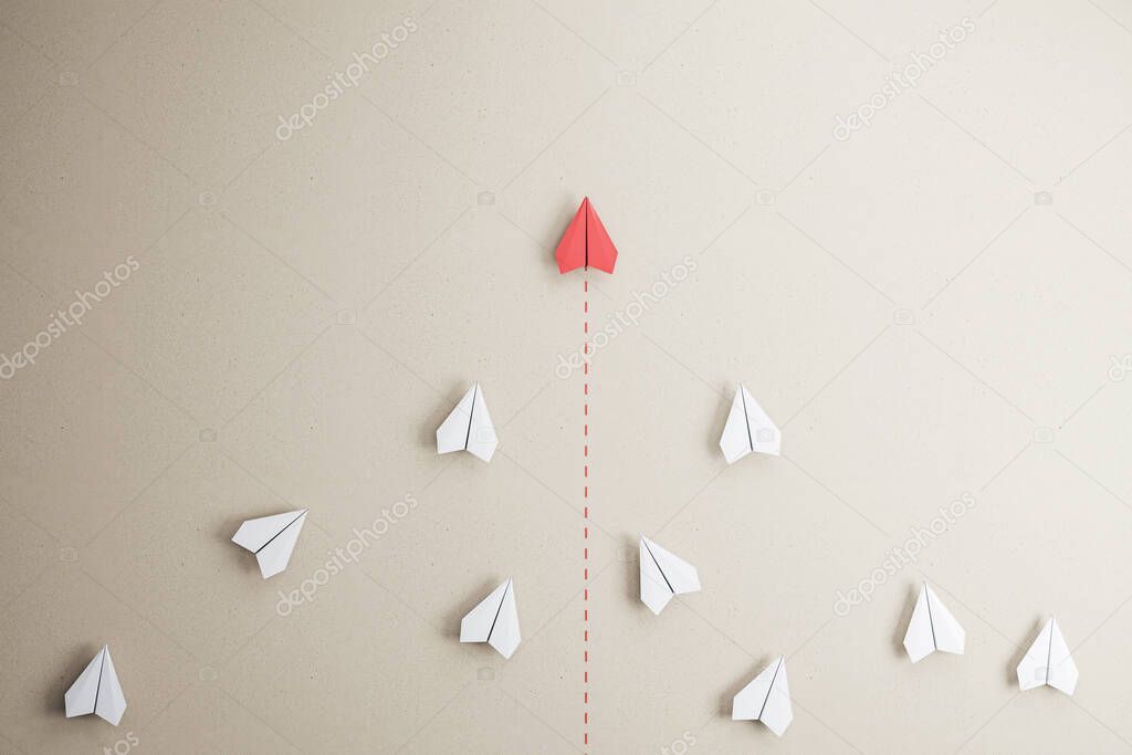 Success goal and creative idea concept with red paper plane compete with white paper planes on abstract beige wallpaper. 3D rendering