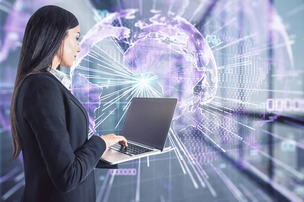 Big data and digital transformation concept with businesswoman working on laptop at digital screen background with the Earth planet layout and abstract rays