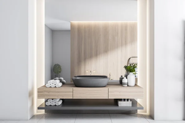 Black washbasin on wooden countertop, wooden partition, light walls and ceramic tales floor in sunny modern bathroom. 3D rendering