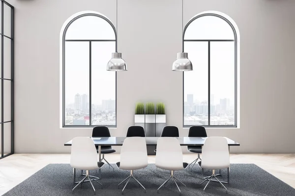 Stylish monochrome conference room in modern office with arched windows and black glossy table surrounded by white chairs on grey carpet. 3D rendering