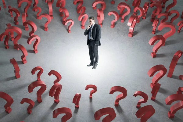 Thoughtful Young Businessman Red Question Marks Concrete Background Solution Quiz — Stock Photo, Image