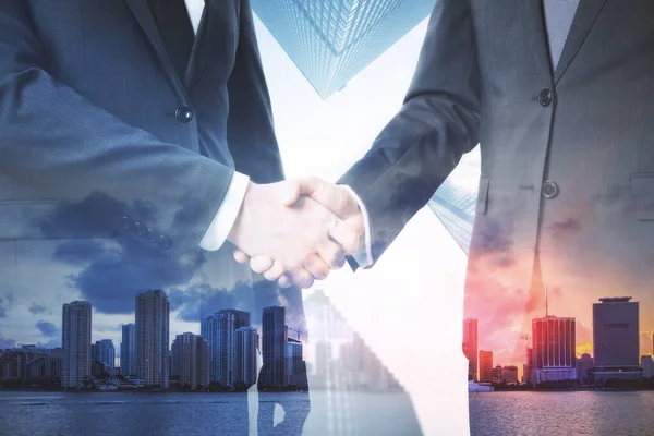 Two Businesspeople Shaking Hands Abstract City Background Teamwork Cooperation Concept — Stock Photo, Image