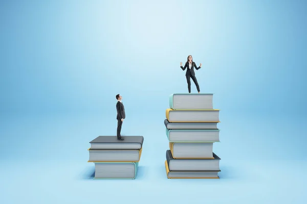 Businessman and woman standing on books on blue background. Competition, education and knowledge concept