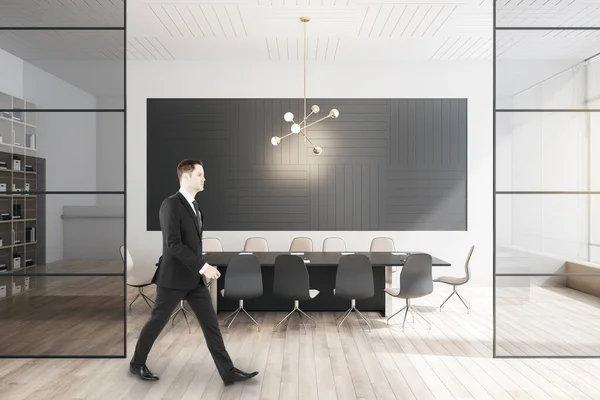 Businessman Walking Modern Meeting Room Interior Large Table Wooden Flooring — 스톡 사진
