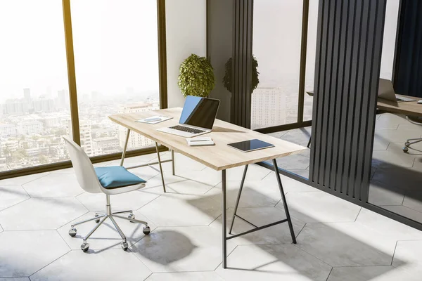Bright workplace with devices in bright office interior with city view and concrete flooring. 3D Rendering.
