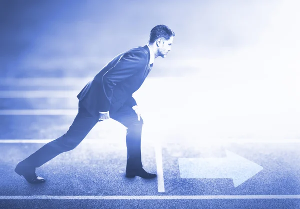 Man standing on running track — Stock Photo, Image