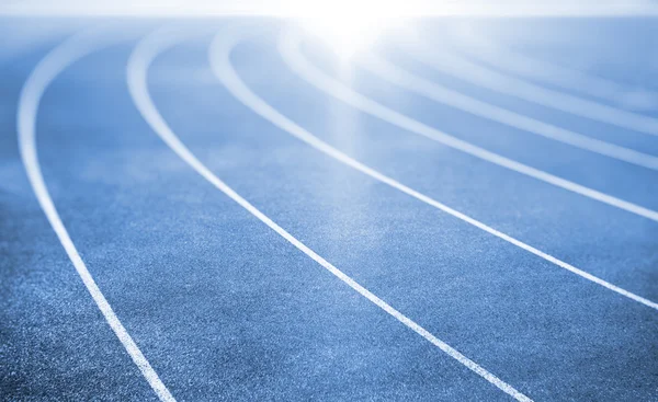 Blue running track — Stock Photo, Image