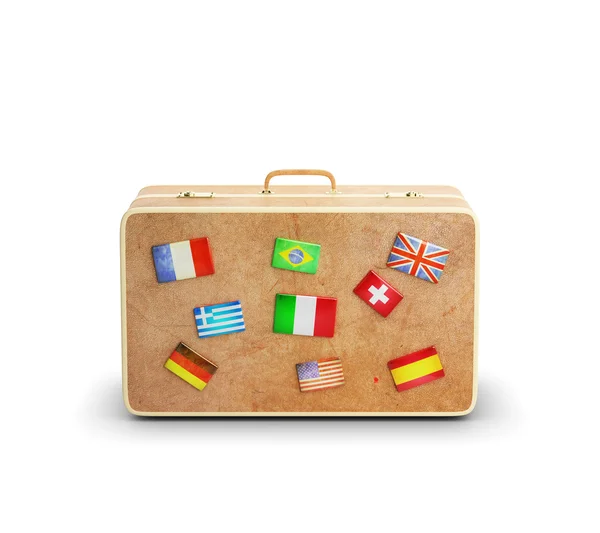 Leer koffer met vlaggen — Stockfoto