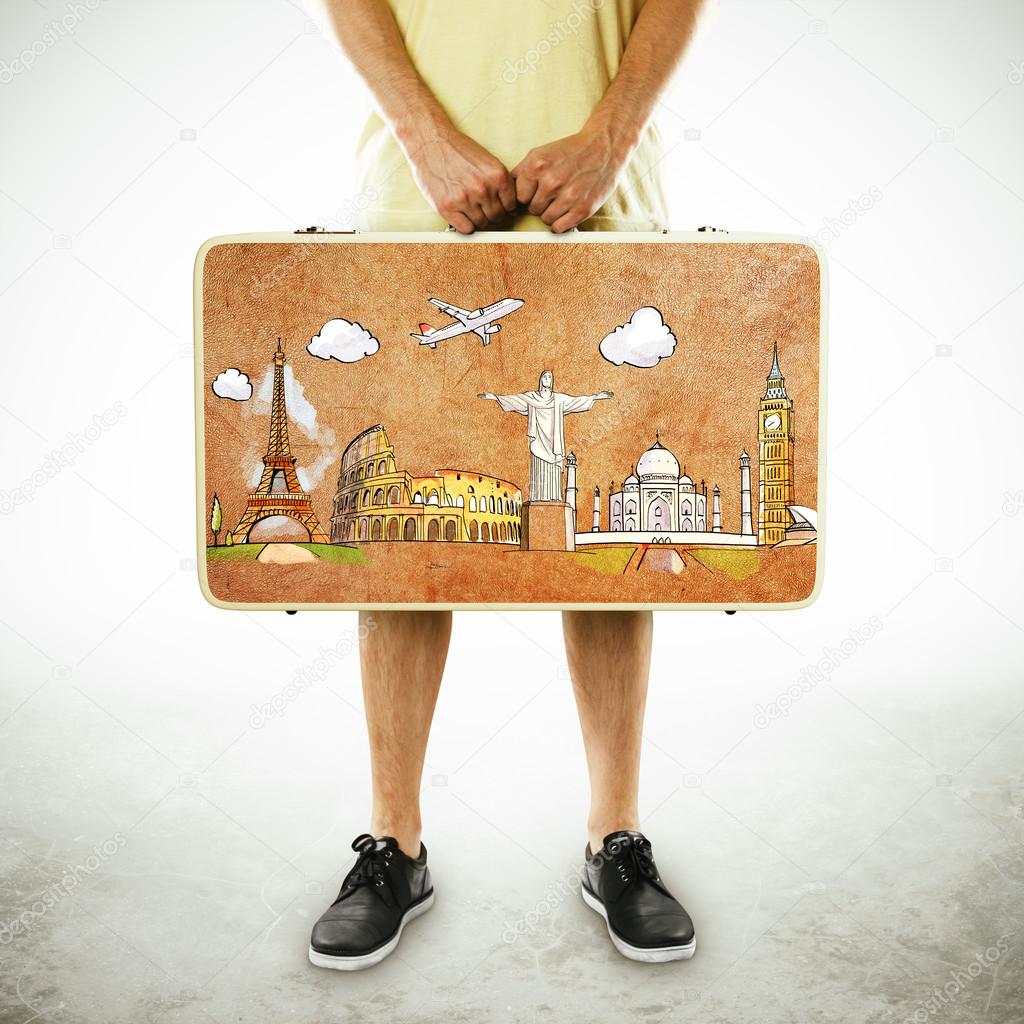 Man holding leather suitcase