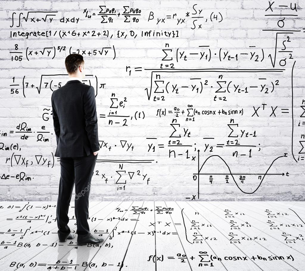 Businessman looking at formula