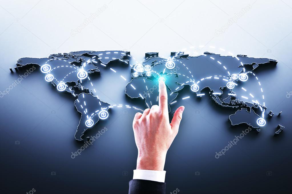 Hand pushing world map