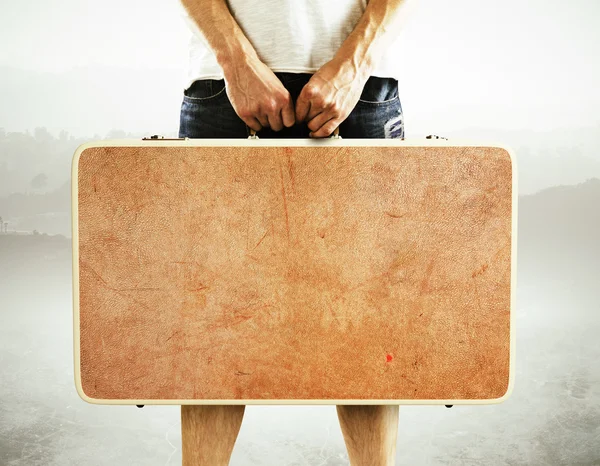 Man holding suitcase — Stock Photo, Image