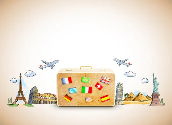 Suitcase and two planes above — Stock Photo, Image