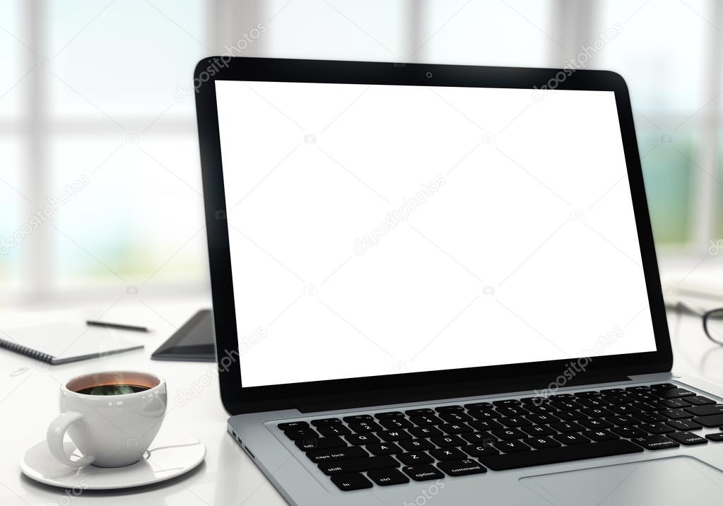 Laptop on table in office