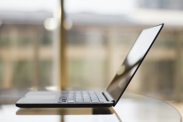 Modern laptop on table — Stock Photo, Image