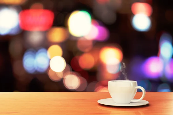 Cup of coffee on wooden table — Stock Photo, Image