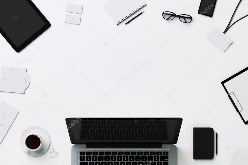 Office stationery, glasses and coffee and laptop