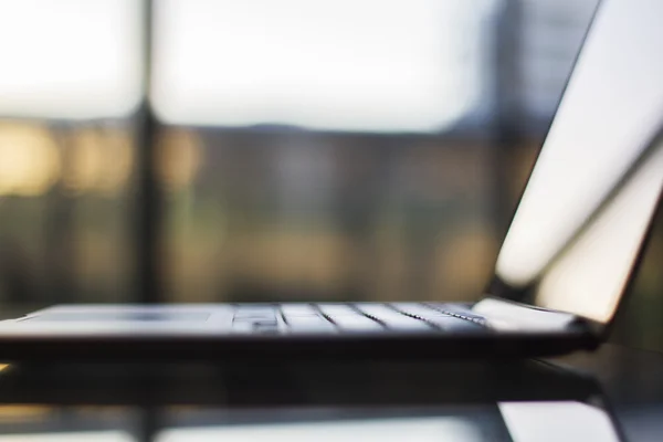 Modern laptop on table — Stock Photo, Image