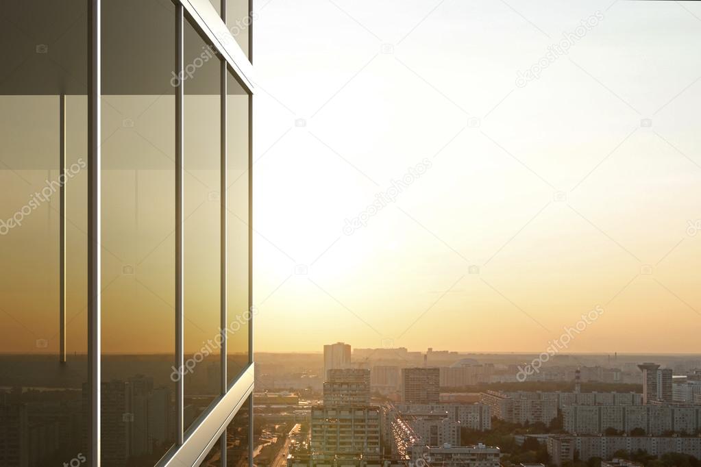 City reflected in  glass of  office building