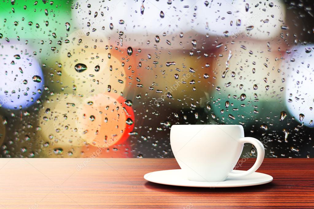 Coffee cup on raindrops background