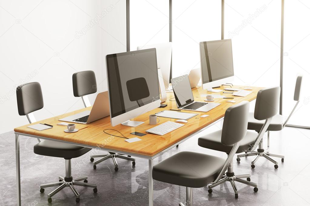 table with office accessories and computers