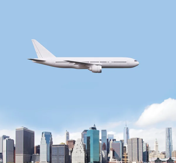 Airplane flying over city — Stock Photo, Image