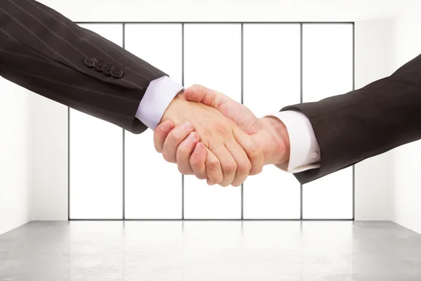 Two businessman handshake in loft style space — Stock Photo, Image