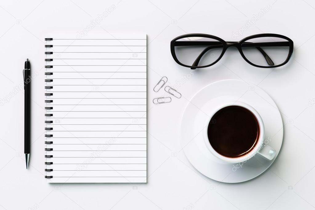 Blank diary, cup of coffee, pen and glasses