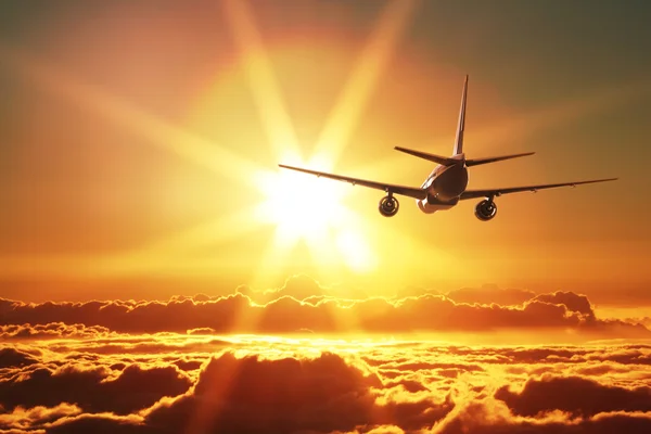 Plane is taking off at sunset — Stock Photo, Image