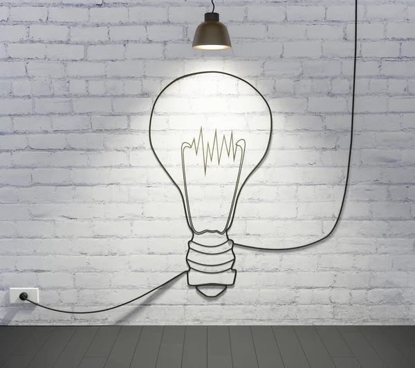 Brick wall with light bulb — Stock Photo, Image