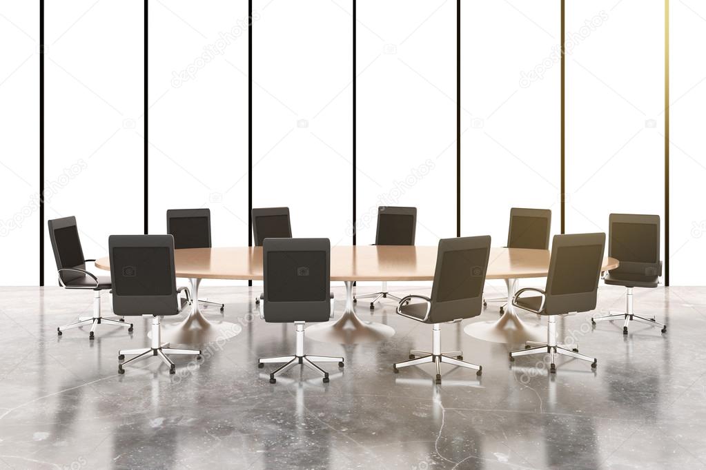 Conference room with round wooden table