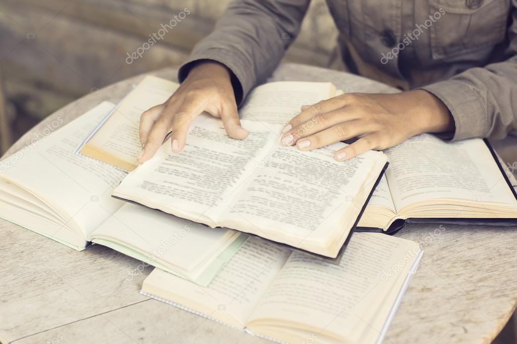 Girl reading several different books