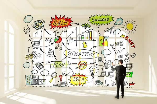 Businessman draws concept of business strategy — Stock Photo, Image