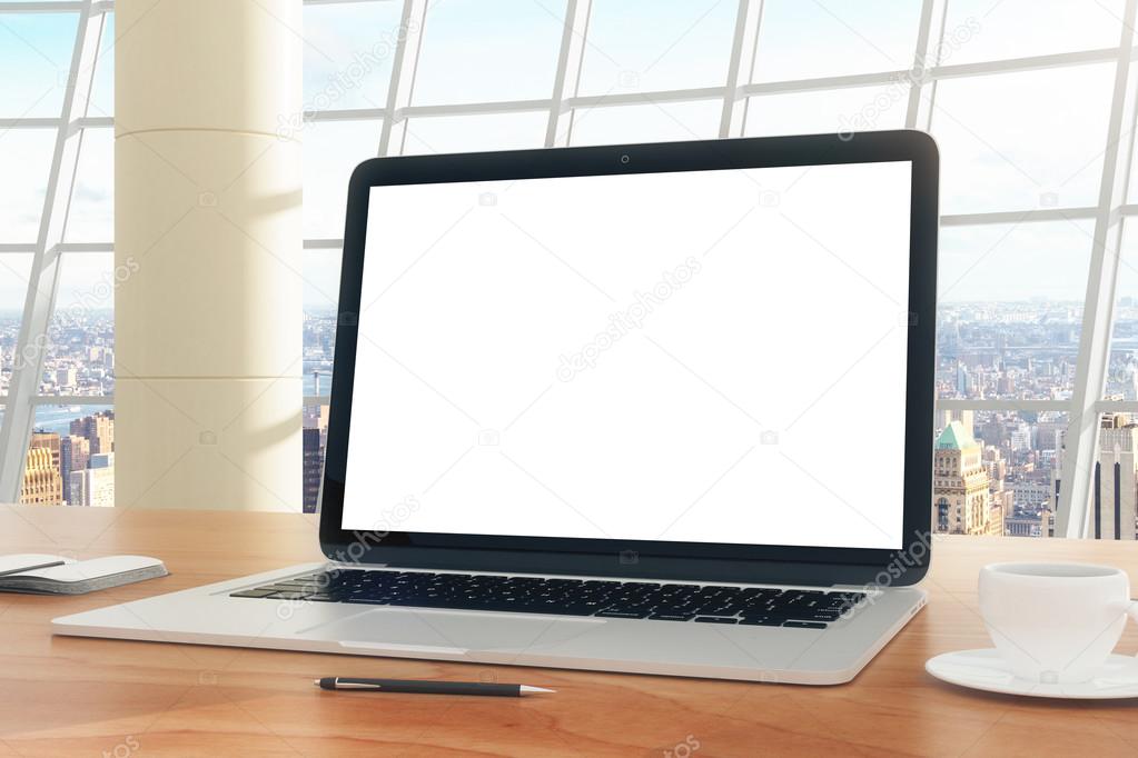 Blank screen of laptop on the table