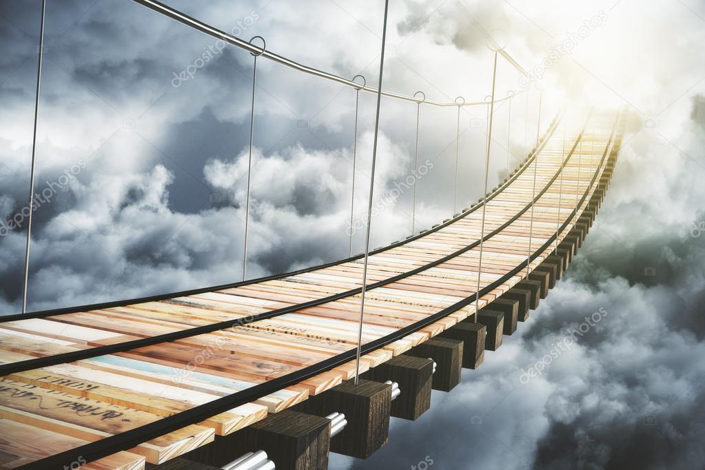 Wooden bridge in the clouds