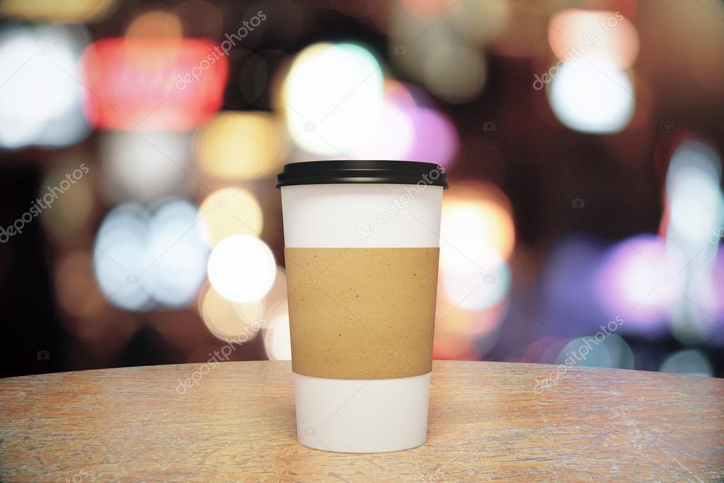 White paper cup of coffee