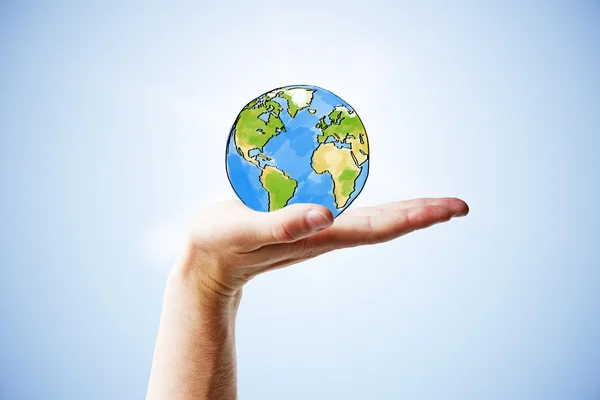Travel concept with man hand and round earth — Stock Photo, Image