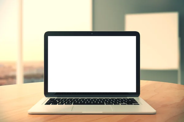 Blank laptop screen on wooden table in the office, mock up — Stock Photo, Image