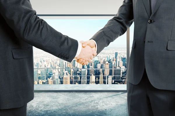 Businessmen shake hands — Stock Photo, Image