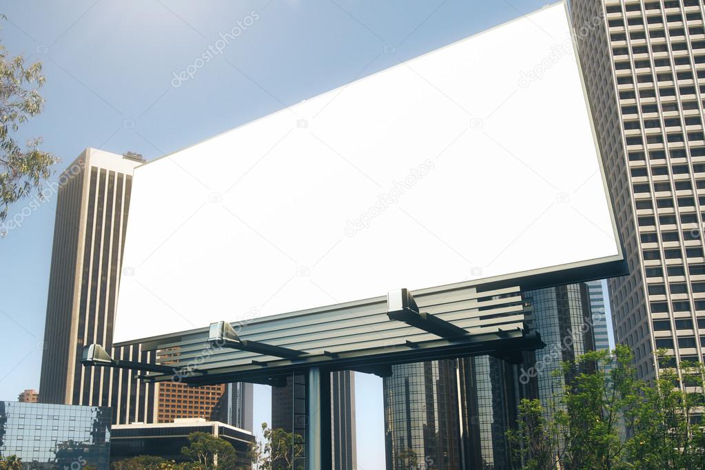 Blank billboard at skyscrapers backgound