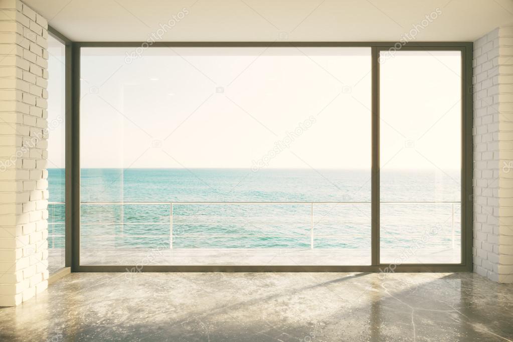 big window in floor and ocean view