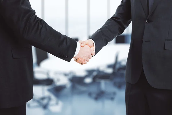 Two businessmen shake hands — Stock Photo, Image