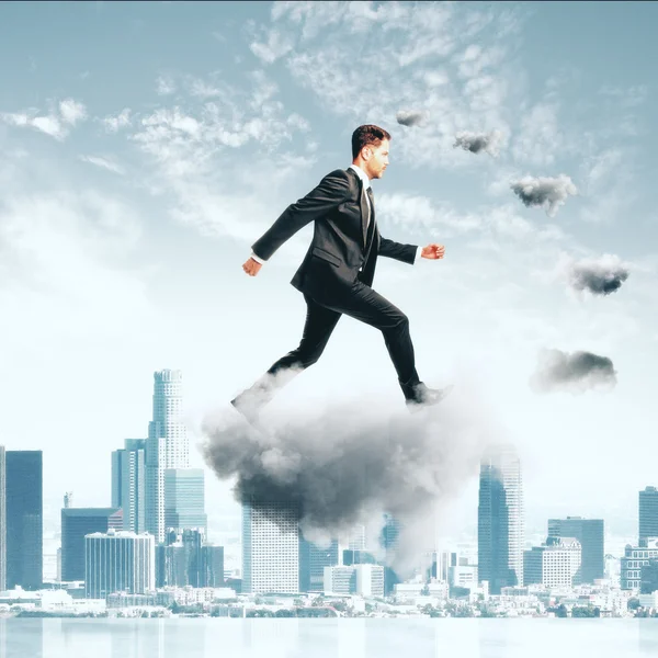 Businessman climbing thecloud ladder at city background concept — Stock Photo, Image