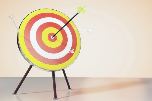 Dart board on the table and a direct hit on target — Stock Photo, Image