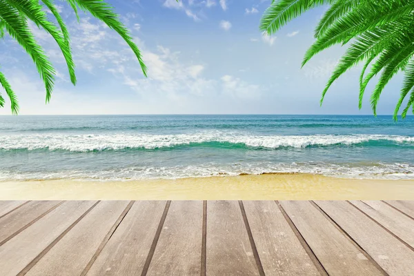 Wooden bench at beach background — Stock Photo, Image