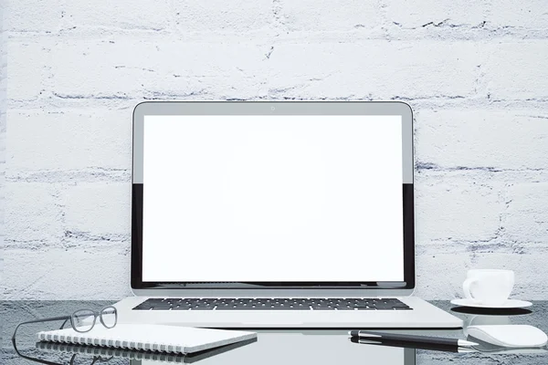 Blank laptop on the table with cup of coffee, diary and accessor