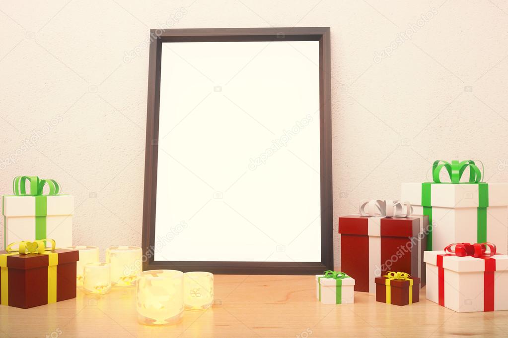 Blank picture frame  with gift boxes and glowing candlesticks on